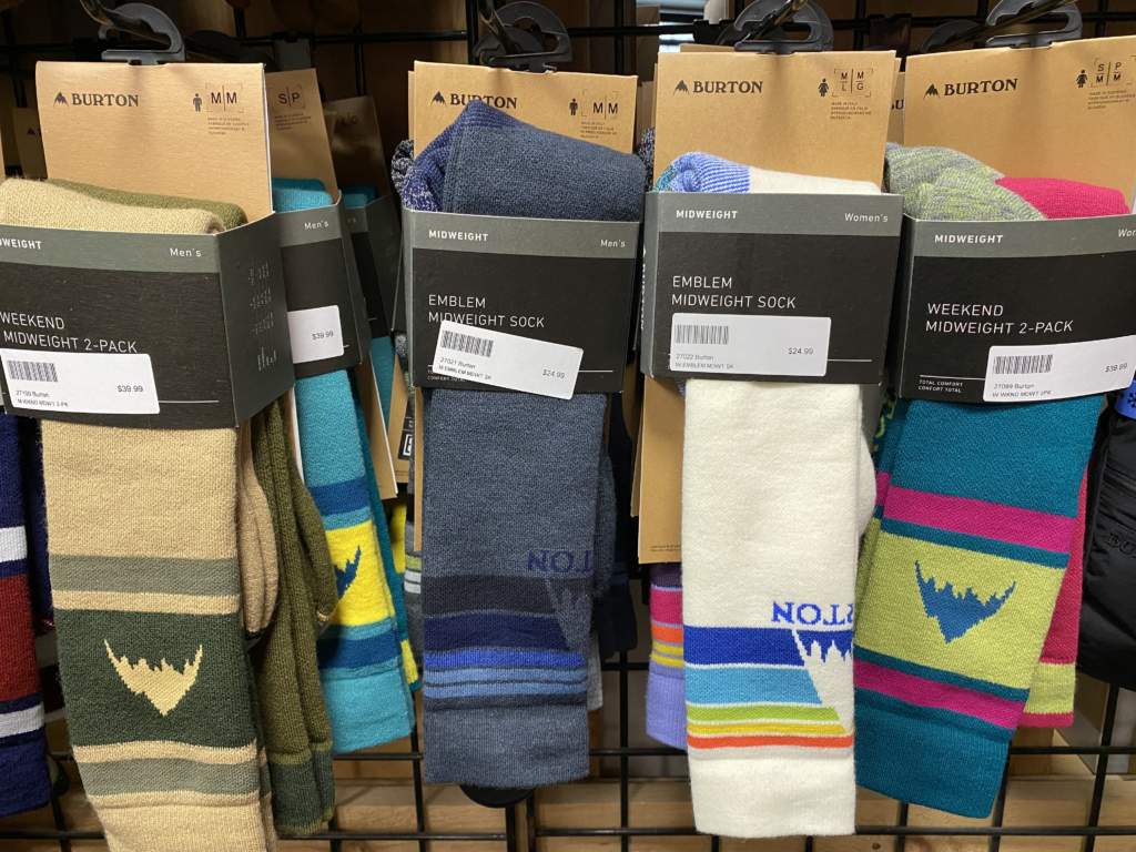 Colourful Burton ski and snowboard socks hanging in a store